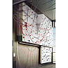 Electrically raisable climbing wall with overhang