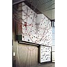 Electrically raisable climbing wall with overhang