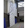Electrically raisable climbing facility without overhang